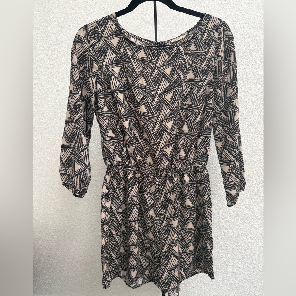 This is a three-quarter sleeve romper from the "Cozy Casual" collection